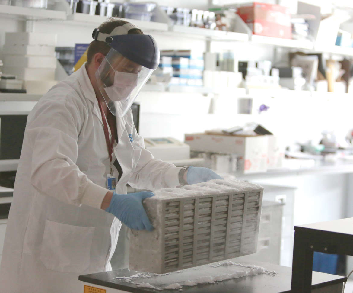 scientist in labratory with mask