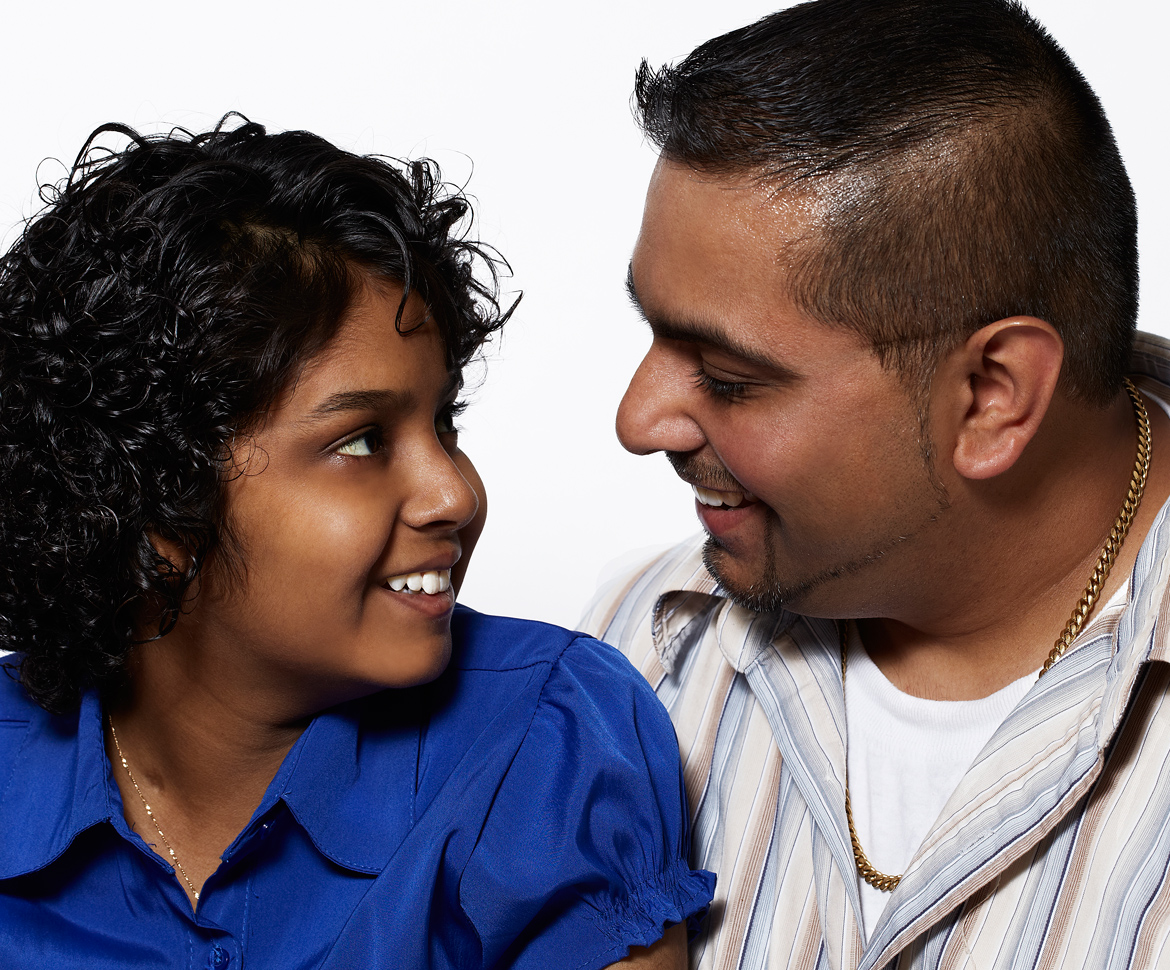 Girl in blue t-shirt looking at dad