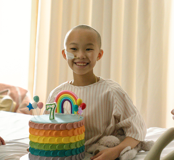 Nori holding a birthday cake