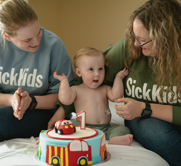 Rowan celebrating birthday with his parents