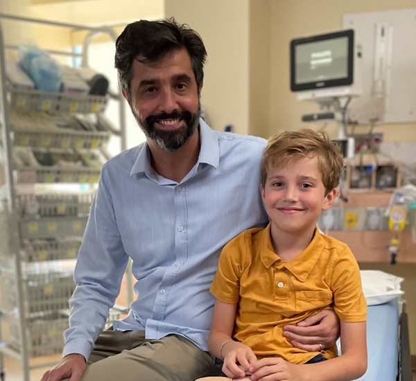 A photo of SickKids Patient Ately smiling in a hospital room