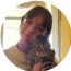 SickKids monthly donor Emma smiling and holding her cat.