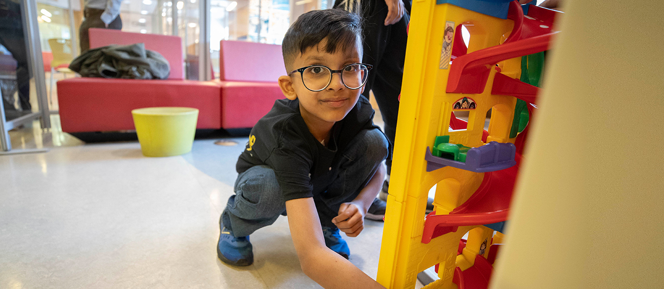 Qais playing with toys