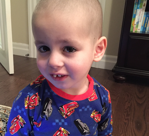 Marky smiling at home, wearing pyjamas.