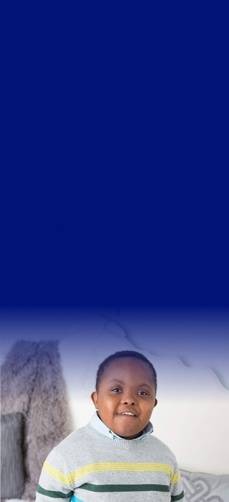 Malcolm smiling at the camera