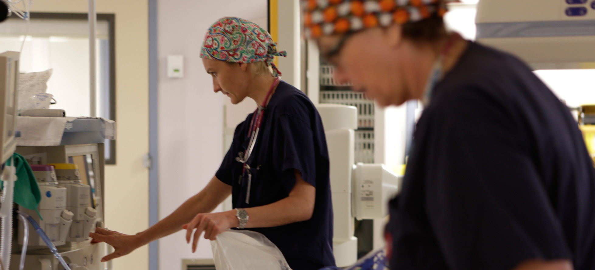 SickKids nurses in scrubs in hospital room