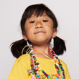 SickKids patient with pig tails and Bravery Beads