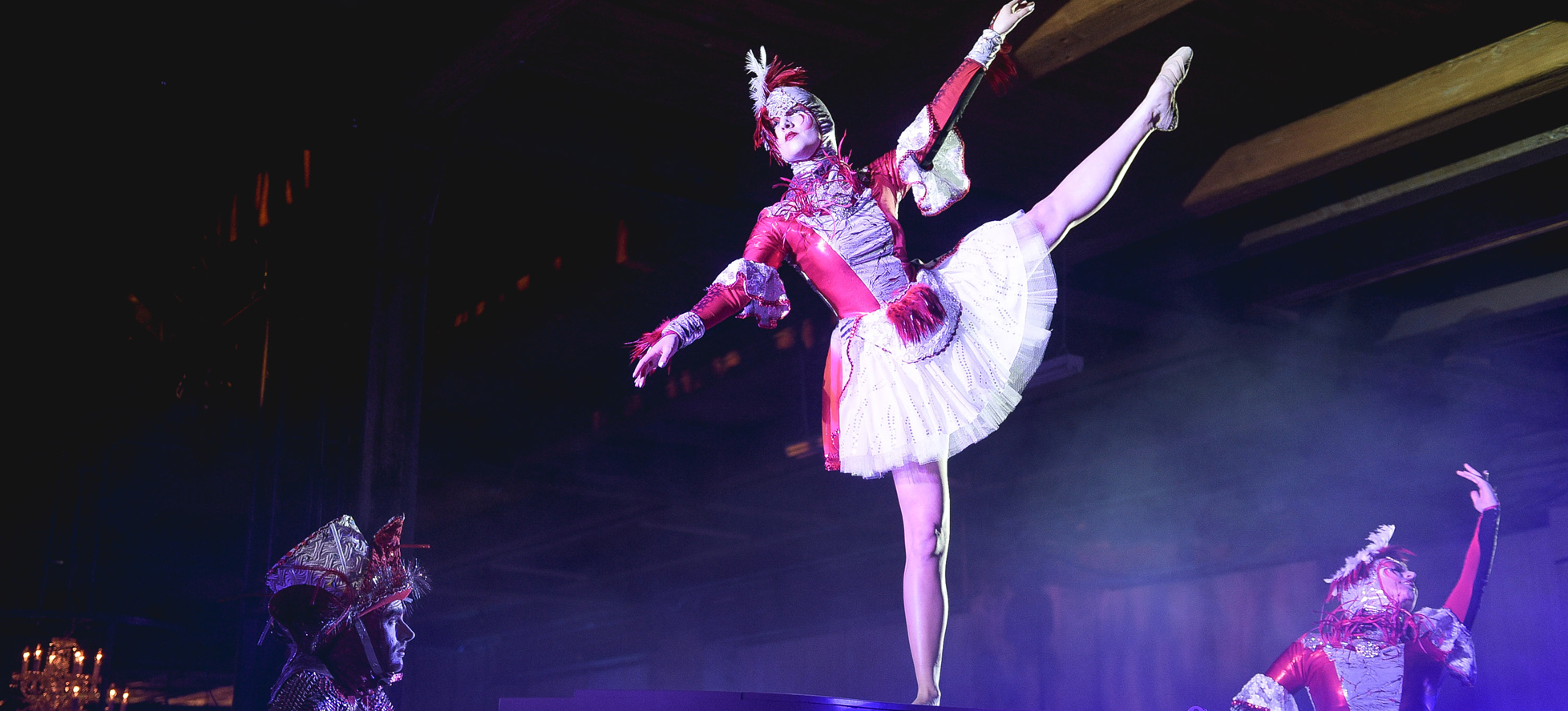 Dancer in costume with leg in the air