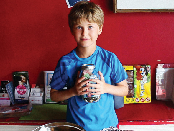 Little boy with jar
