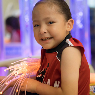 Boy holding glowsticks