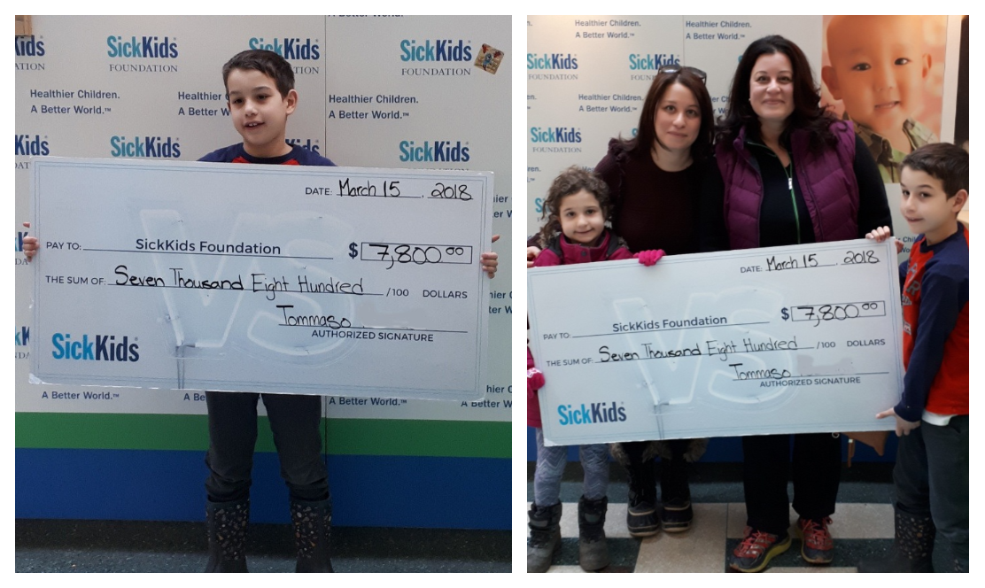 Boy holding large cheque