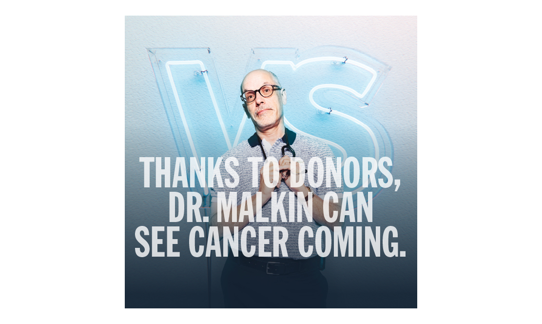 SickKids doctor standing in front of VS logo