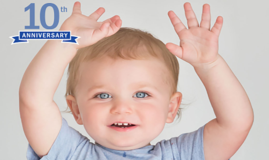 Little boy with hands in the air