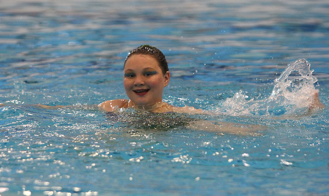 Photo of SickKids patient Ruby in the swimming pool doing synchronized swimming