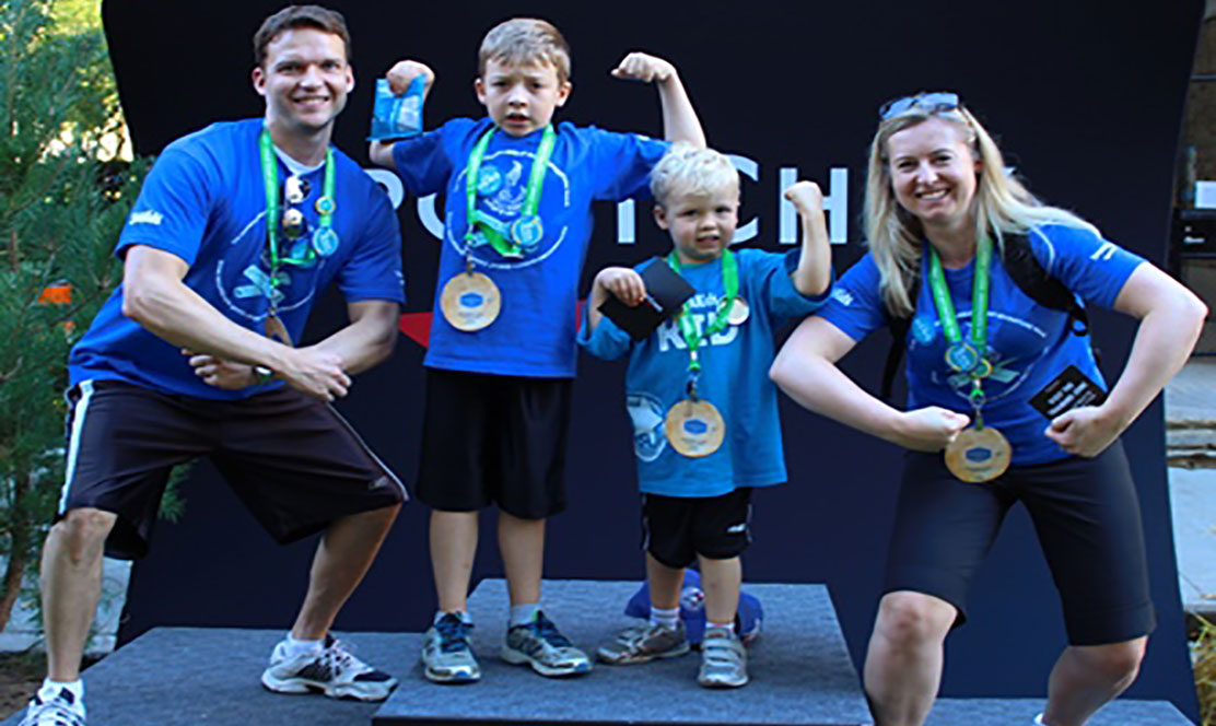 Family posing at Great Camp Adventure Walk