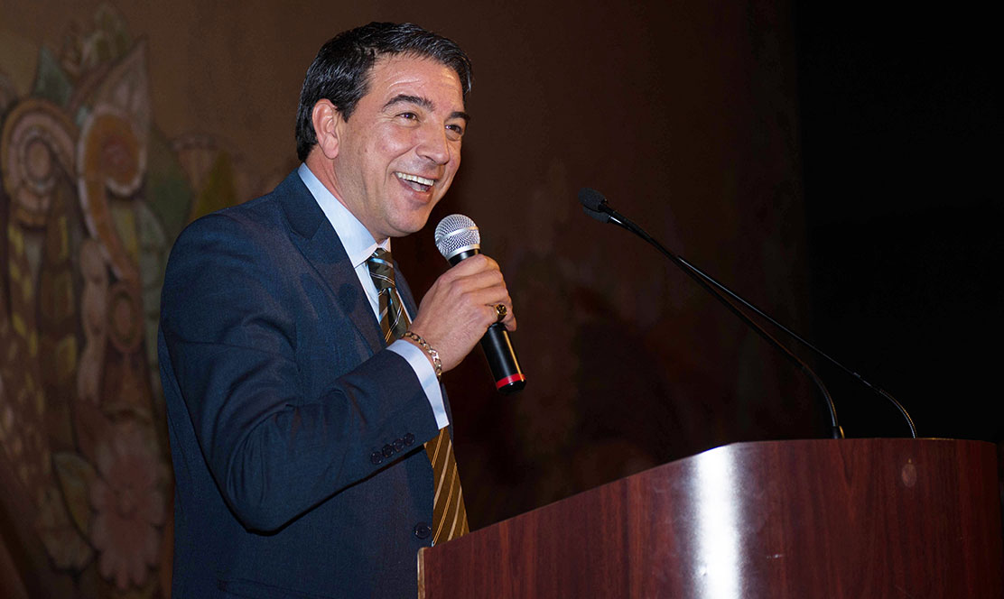 Man speaking at a podium
