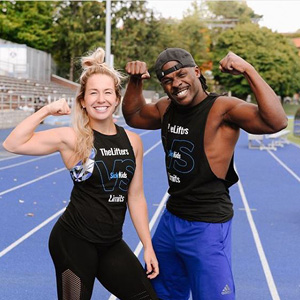 Cassie Day and husband posing on a race track