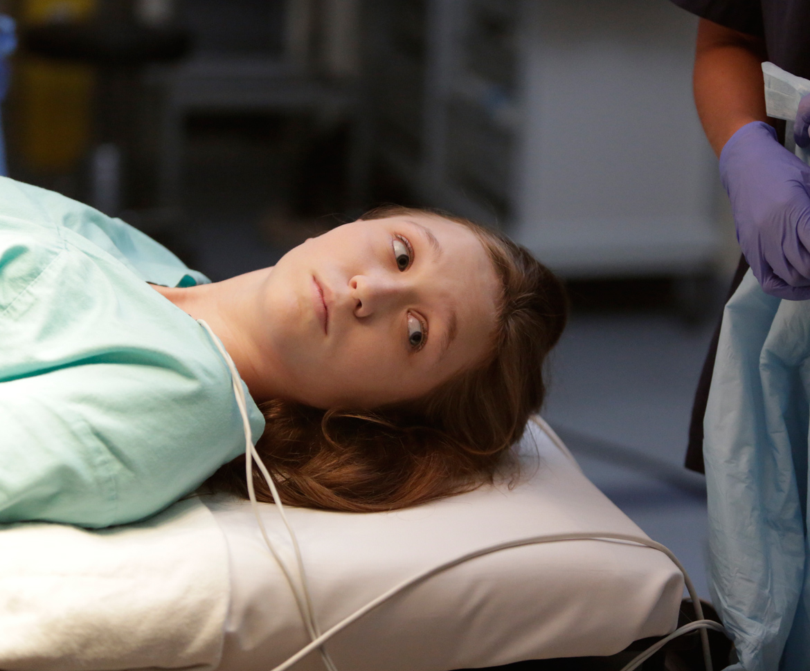 patient laying down on gurney waiting for procedure