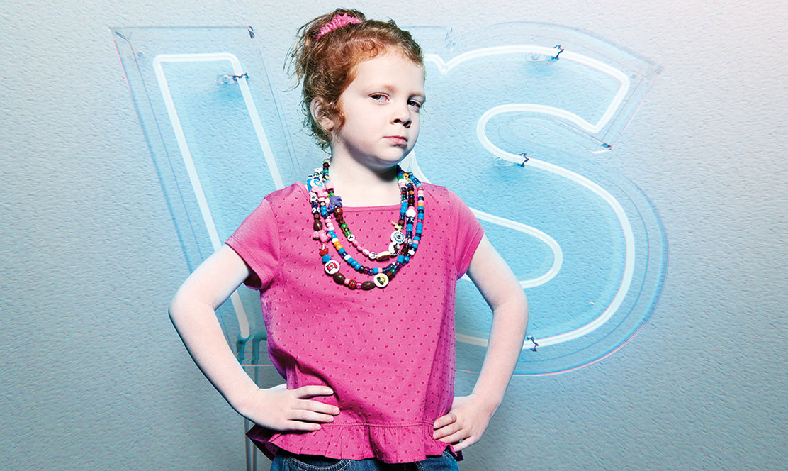 Little girl standing with hands on her hips